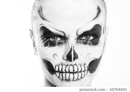 Girl with creative halloween face art on white 30764093