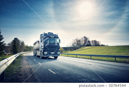 lorry moving on sunny evening 30764594
