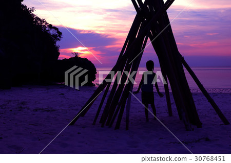 Asian girl stands under a bamboo dome on the beach Asian girl stands under a bamboo dome on the beach 30768451