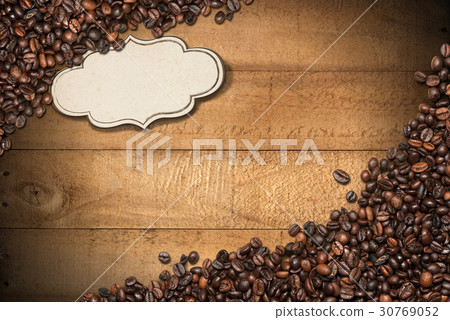 Coffee Beans on Wood Background Coffee Beans on Wood Background 30769052