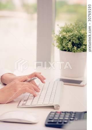 Typing office worker Typing office worker 30769193