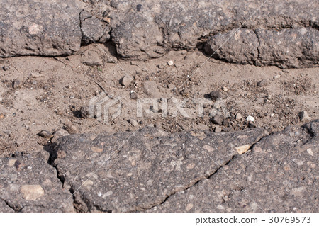 large pit with stones on the asphalt highway large pit with stones on the asphalt highway 30769573