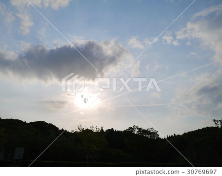 Sunset and an airplane cloud 30769697