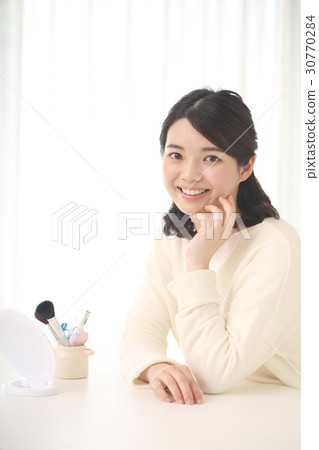 A woman glad that her skin is beautiful A woman glad that her skin is beautiful 30770284