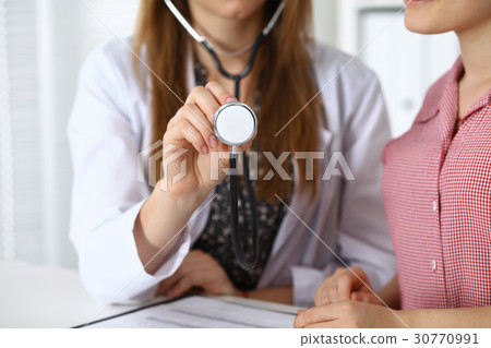 Doctor with a stethoscope in the hand. Physician 30770991