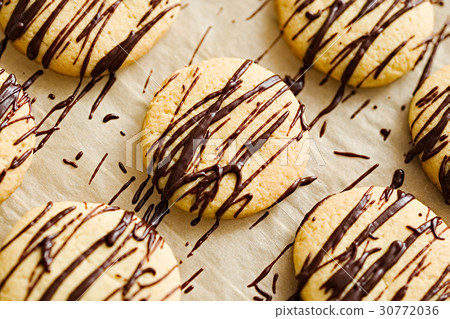 Homemade cookies with a dark chocolate drizzle Homemade cookies with a dark chocolate drizzle 30772036