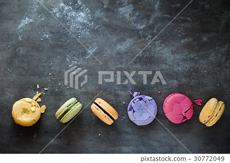 Colorful french macaroons on a dark Colorful french macaroons on a dark 30772049