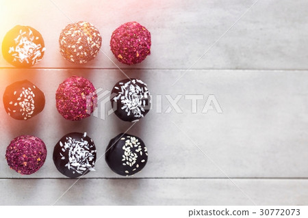 Energy balls, raw chocolate truffles from above Energy balls, raw chocolate truffles from above 30772073