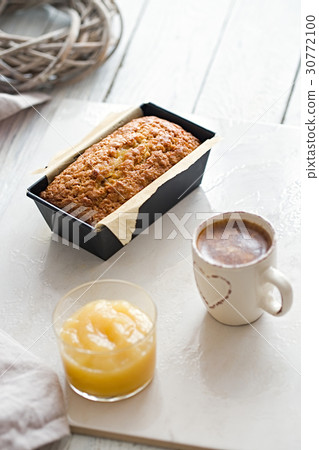 Glazed applesauce oatmeal bread on a white marble  30772100