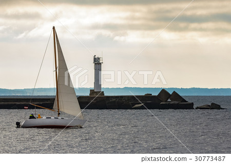 White sailboat traveling White sailboat traveling 30773487