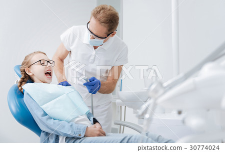 Enthusiastic little lady undergoing a procedure Enthusiastic little lady undergoing a procedure 30774024