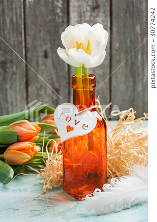 Orange tulips with wooden heart Orange tulips with wooden heart 30774242