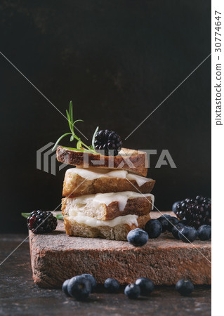Sandwich with goat cheese and berries 30774647