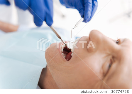 Dedicated attentive man receiving medical Dedicated attentive man receiving medical 30774738