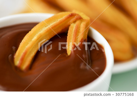 churros con chocolate, typical Spanish sweet snack 30775168