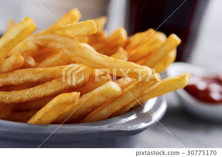 appetizing french fries in a metal basket 30775170