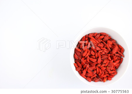 dried goji berries in a small white bowl 30775563
