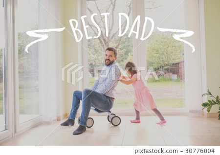 Father and daughter riding bike indoors. Fathers 30776004