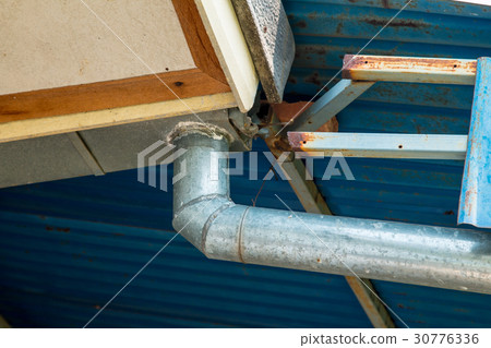 Corner of the house with gutters zinc 30776336