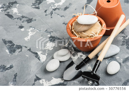 Gardening tools and clay terracotta flower pots Gardening tools and clay terracotta flower pots 30776556