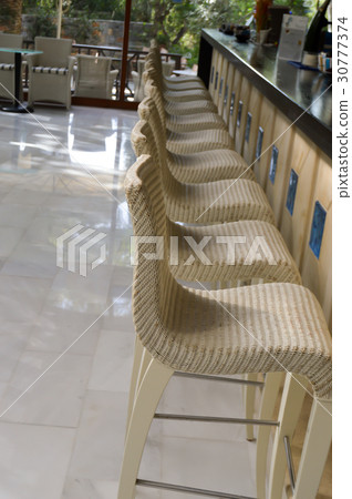 Bar with white stools Bar with white stools 30777374
