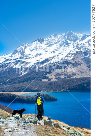 Girl in hiking mountain with her faithful dog 30777627
