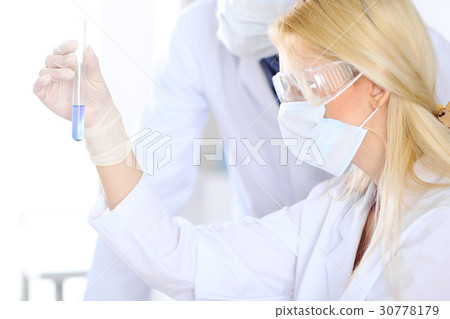 Female scientific research team with clear Female scientific research team with clear 30778179