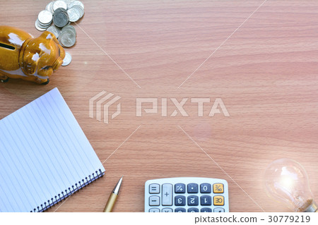 Blank memory book with pen and piggy bank 30779219