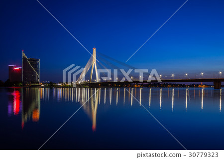 Illuminated bridge at twilight in Riga, Latvia. 30779323