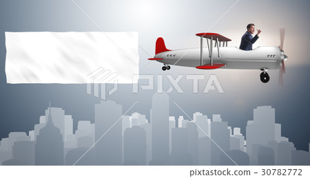 Biplane with businessman and blank banner 30782772