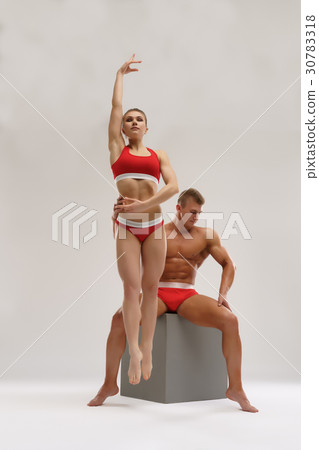 Sexy couple of bodybuilders together in studio Sexy couple of bodybuilders together in studio 30783318