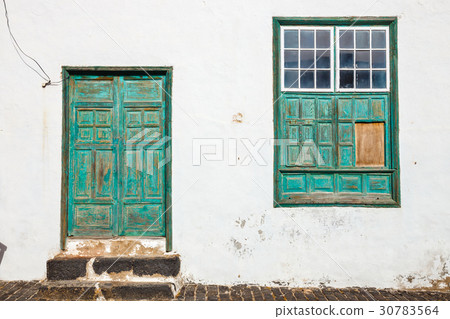 green door and window on white wall background 30783564