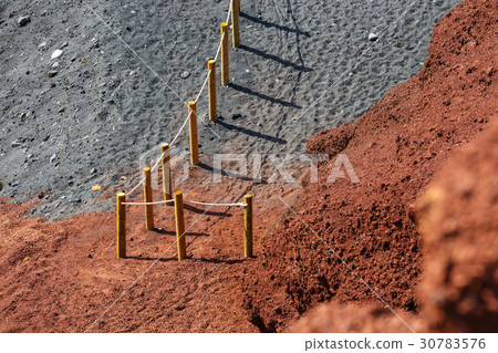 Wooden fence on an El Golfo beach in Lanzarote Wooden fence on an El Golfo beach in Lanzarote 30783576