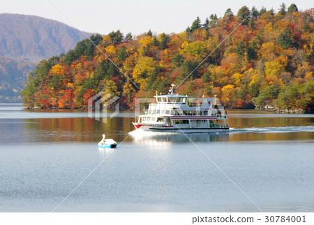 Towada lake in autumn leaves and a pleasure boat 30784001