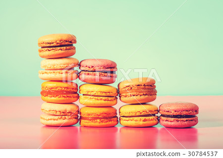 Colorful macarons on a bright pastel background 30784537
