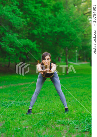Girl in the park doing exercises 30784903