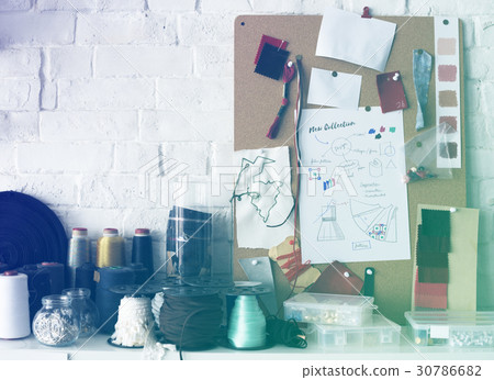 Fashion design's creative messy desk 30786682