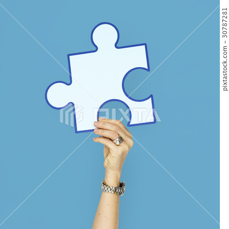 Human Hand Holding Puzzle Piece Human Hand Holding Puzzle Piece 30787281