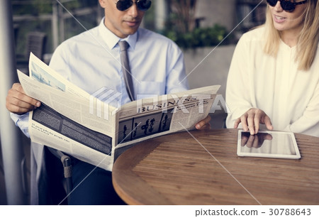 Businessmen Reading Newspaper Women Use Tablet Businessmen Reading Newspaper Women Use Tablet 30788643