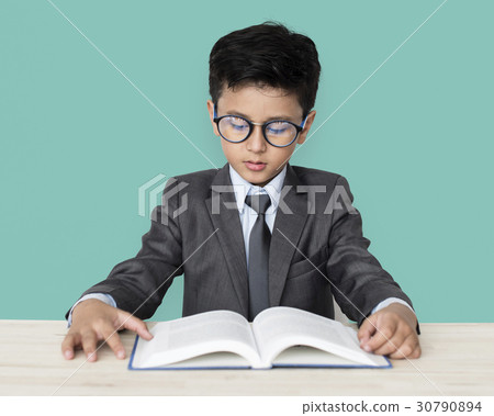 A Caucasian Boy With Glasses Reading Book Background Studio Portrait 30790894