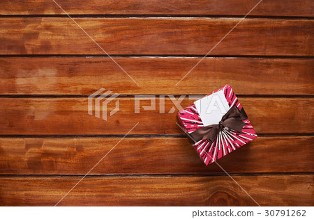 One gift box on wooden table 30791262