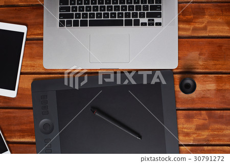 Modern gadgets on wooden table Modern gadgets on wooden table 30791272