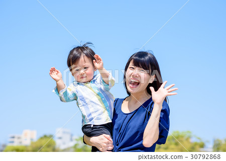 Parent-child waving hands Mother and child 30792868