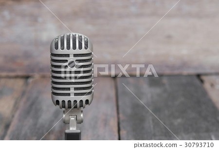 Retro microphone Vintage style on  wood background 30793710