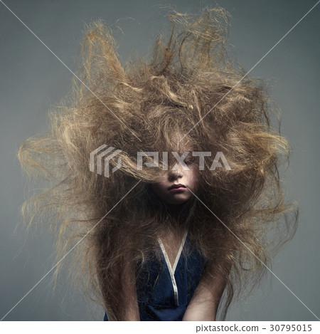 Young girl with a volume fashionable hairstyle Young girl with a volume fashionable hairstyle 30795015