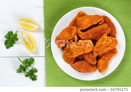 Parmesan breaded crusted Chicken nuggets, top view Parmesan breaded crusted Chicken nuggets, top view 30795273