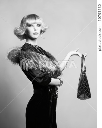 Young beautiful lady in elegant dress 30795380