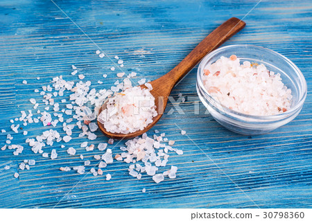 Large pink sea salt on blue background 30798360