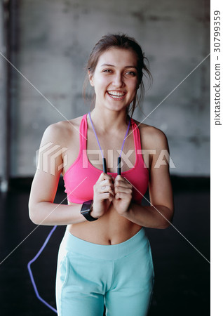 beautiful woman with skipping rope in the gym beautiful woman with skipping rope in the gym 30799359