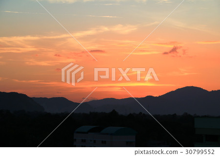 Sunset in sky color evening  with city silhouette 30799552